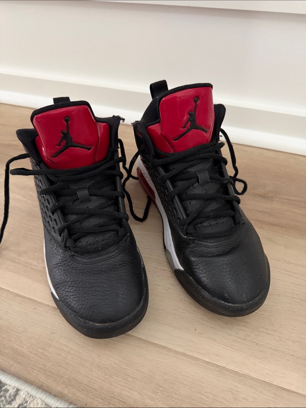 Nike True Flight Black and Red High-Top Sneakers.